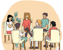 group of people sitting in a circle, talking