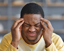 Person holding their head