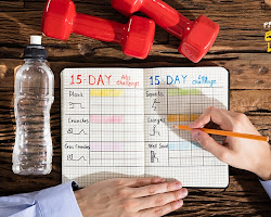 Person writing down their workout plan