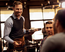 customer and a waiter having a friendly conversation