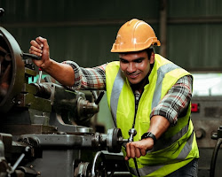 factory worker operating machinery