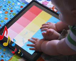 infant playing with an interactive app