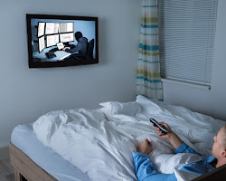 person looking at a screen before going to bed