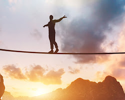 person walking on a tightrope