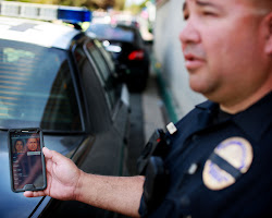 police officer using facial recognition software