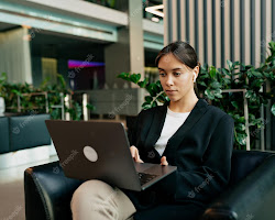 woman sitting at her computer, typing in a chatroom